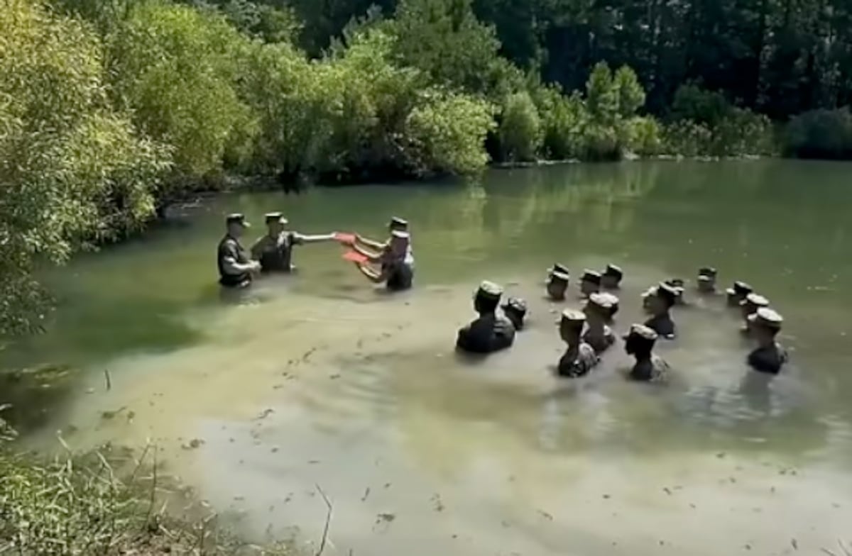 Watch these Marines reenlist in a chest-deep swamp