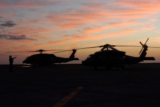 Navy’s ‘dinosaur’ carrier delivery plane flies into sunset
